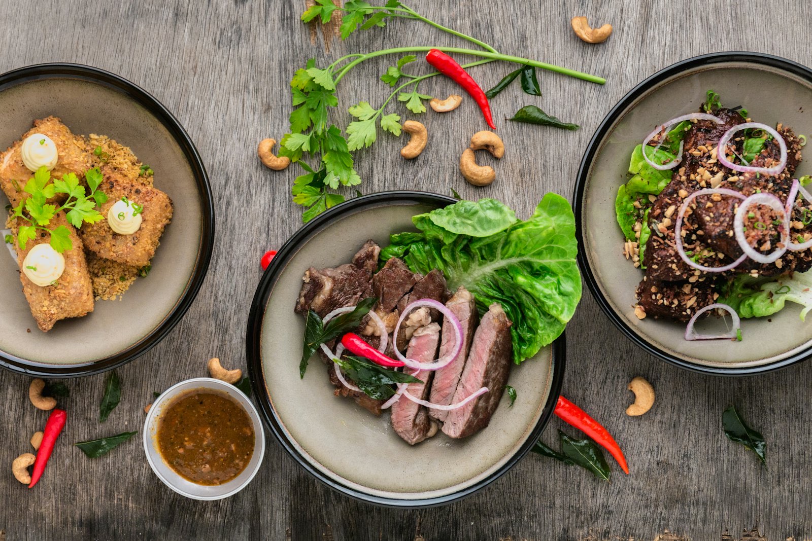 Bowls of home-cooked dishes arranged on a wooden table